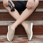 Mocasines casuales transpirables de lona blanca para hombre.